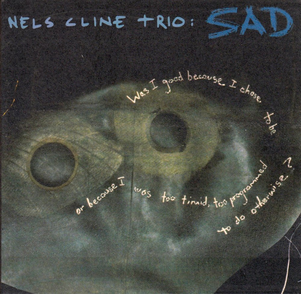 Nels Cline.(1956). Sad Trio. Nels Cline & Gregg Bendian - Interstellar Space revisited the Music of John Coltrane. Cline Carditosale.